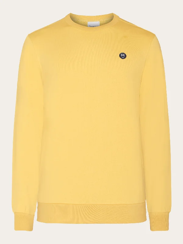 Big discounts – don’t miss out!  Basic badge sweat - Misted Yellow