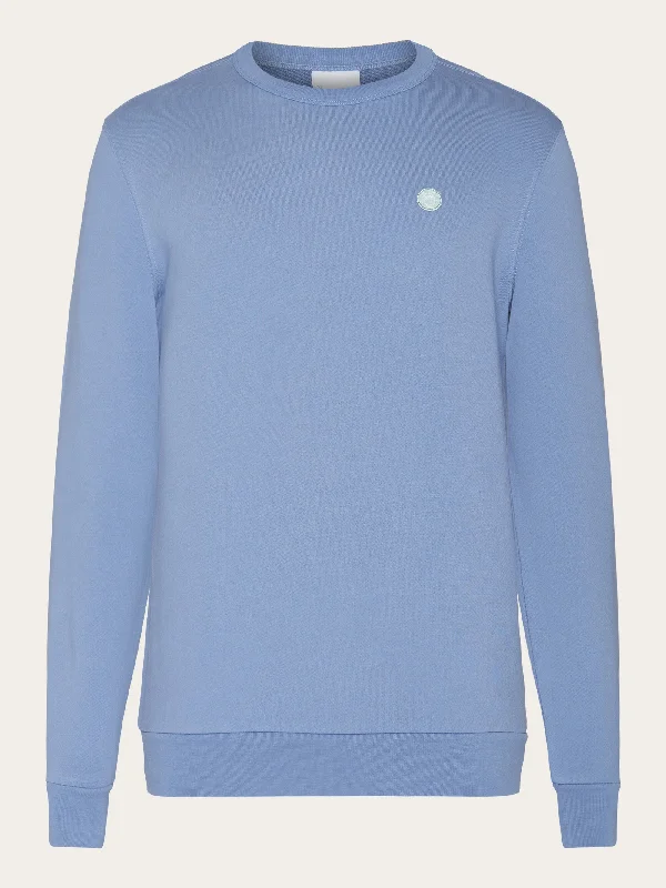 Time to upgrade your wardrobe – shop men’s fashion on sale. Basic badge sweat - Moonlight Blue Time to upgrade your wardrobe – shop men’s fashion on sale. Basic badge sweat - Moonlight Blue