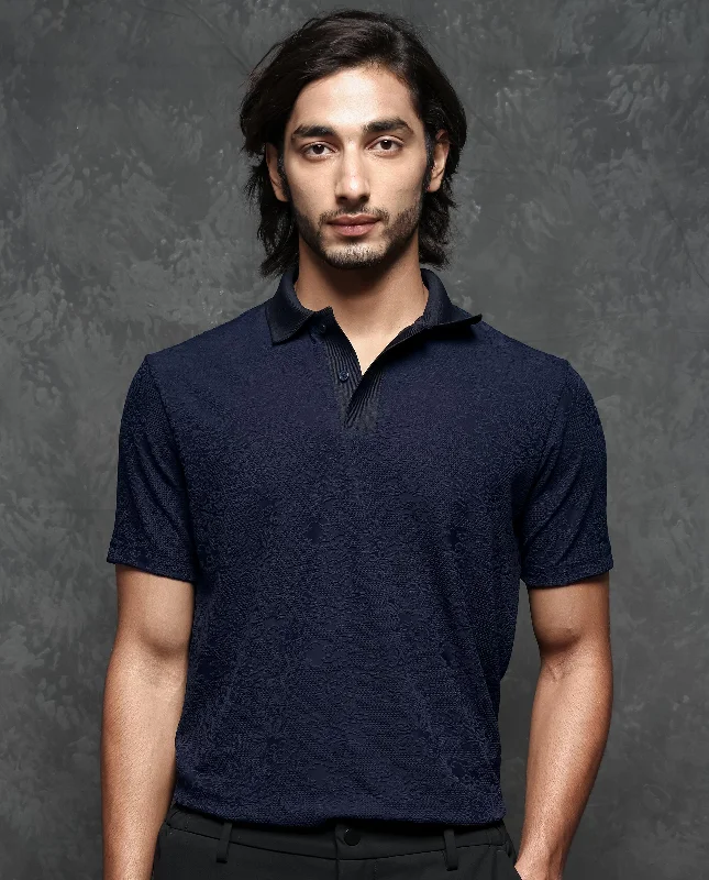 Get stylish outfits for every occasion – Shop now and save! Rare Rabbit Men's Criuse Navy Polyester Fabric Collared Neck Half Sleeve Floral Jacquard Polo T-Shirt Get stylish outfits for every occasion – Shop now and save! Rare Rabbit Men's Criuse Navy Polyester Fabric Collared Neck Half Sleeve Floral Jacquard Polo T-Shirt
