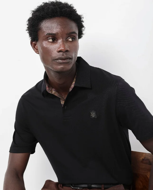 Don’t miss out – huge discounts on men’s trendy styles. Rare Rabbit Men's Spencer Black Short Sleeve Button Closure Regular Fit Solid Polo T-Shirt Don’t miss out – huge discounts on men’s trendy styles. Rare Rabbit Men's Spencer Black Short Sleeve Button Closure Regular Fit Solid Polo T-Shirt