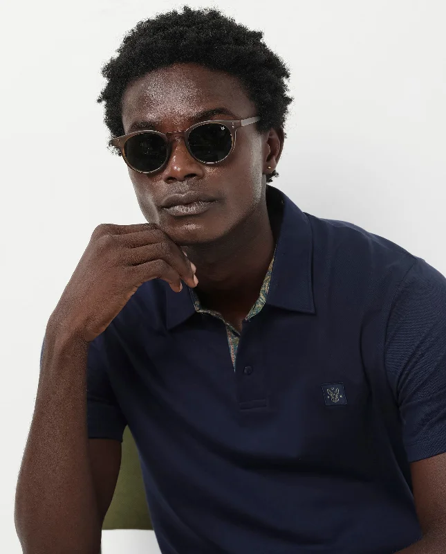 Upgrade your wardrobe with stylish men's apparel – now on sale! Rare Rabbit Men's Spencer Navy Short Sleeve Button Closure Regular Fit Solid Polo T-Shirt Upgrade your wardrobe with stylish men's apparel – now on sale! Rare Rabbit Men's Spencer Navy Short Sleeve Button Closure Regular Fit Solid Polo T-Shirt